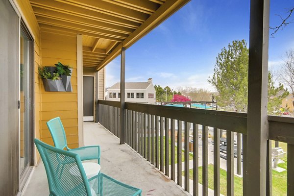 Tuscan Heights Apartments: Cozy patio with scenic views in a serene setting