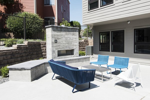 Cozy fire pit area with seating at Tuscan Heights Apartments, perfect for relaxation and social gatherings in a luxurious setting