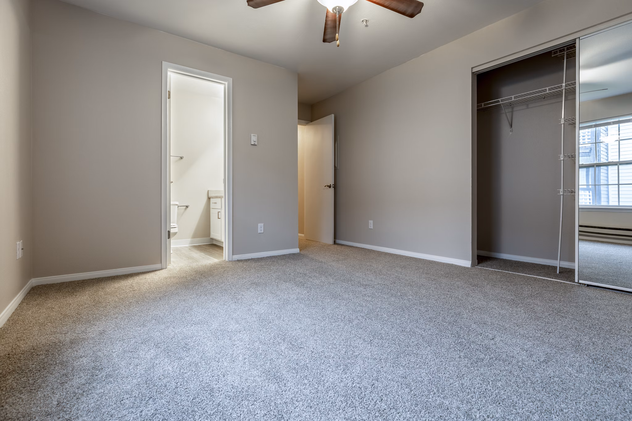 Spacious bedroom with modern furnishings at Huntington Park Apartments