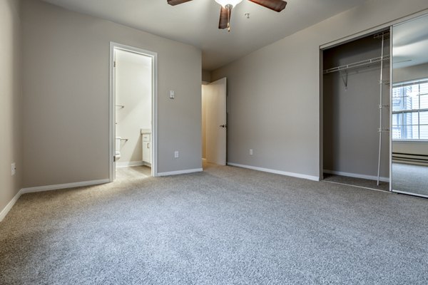 Spacious bedroom with modern furnishings at Huntington Park Apartments