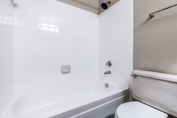 Bathroom featuring modern fixtures and sleek design in Huntington Park Apartments