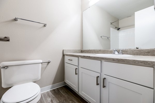 Modern bathroom with sleek fixtures at Huntington Park Apartments