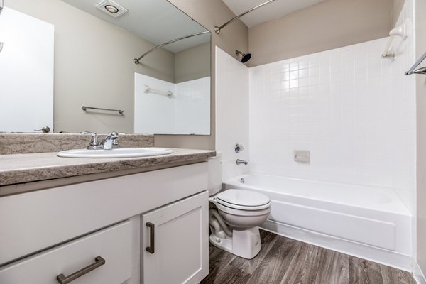 Modern bathroom with sleek fixtures at Huntington Park Apartments