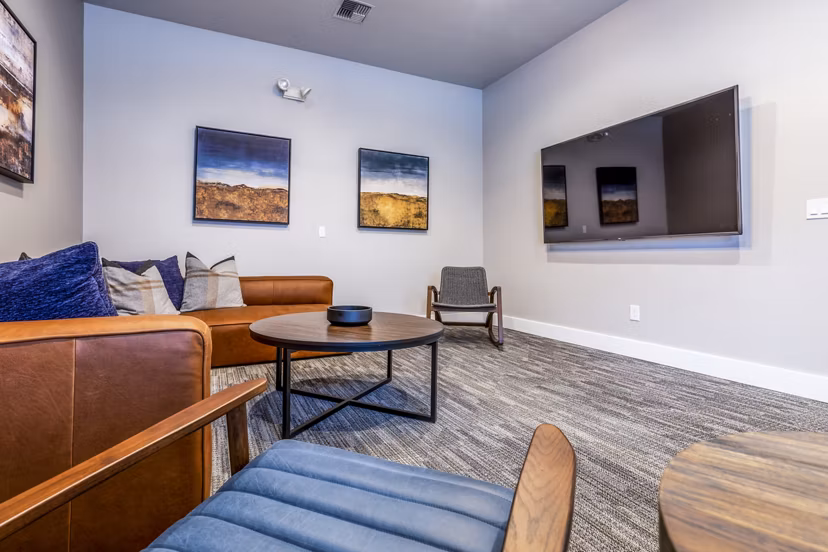 State-of-the-art theater in Huntington Park Apartments, offering luxury movie-watching experiences with plush seating and surround sound