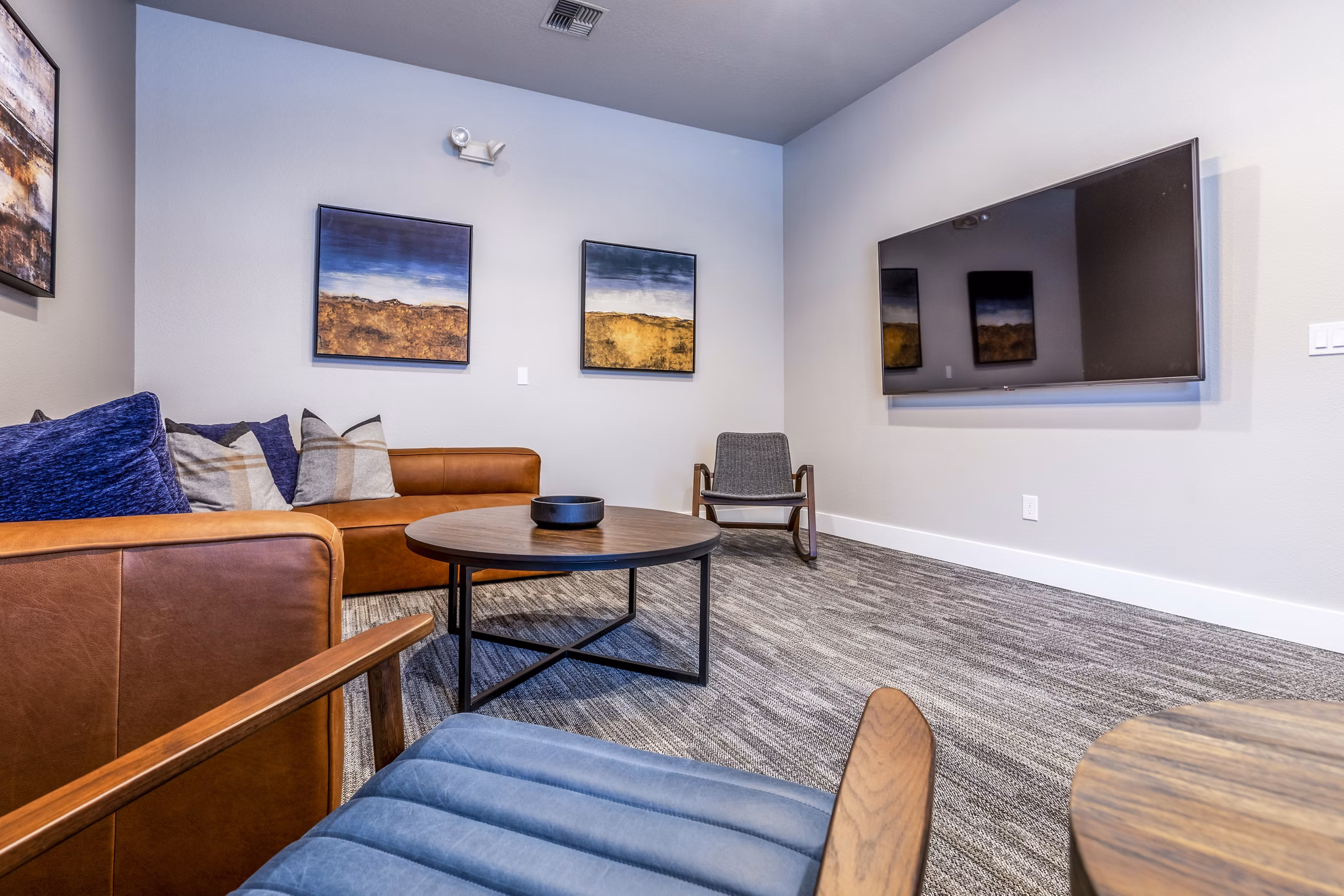 State-of-the-art theater in Huntington Park Apartments, offering luxury movie-watching experiences with plush seating and surround sound