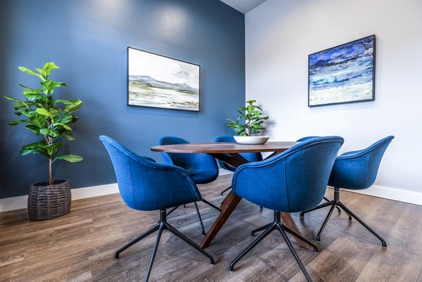 Meeting room with conference table and chairs at Huntington Park Apartments, ideal for business events and gatherings
