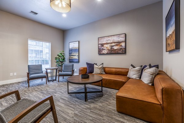Theater with plush seating and large screen at Huntington Park Apartments