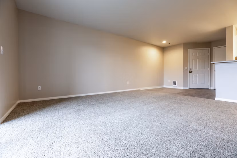 Spacious living room with modern furnishings at Huntington Park Apartments