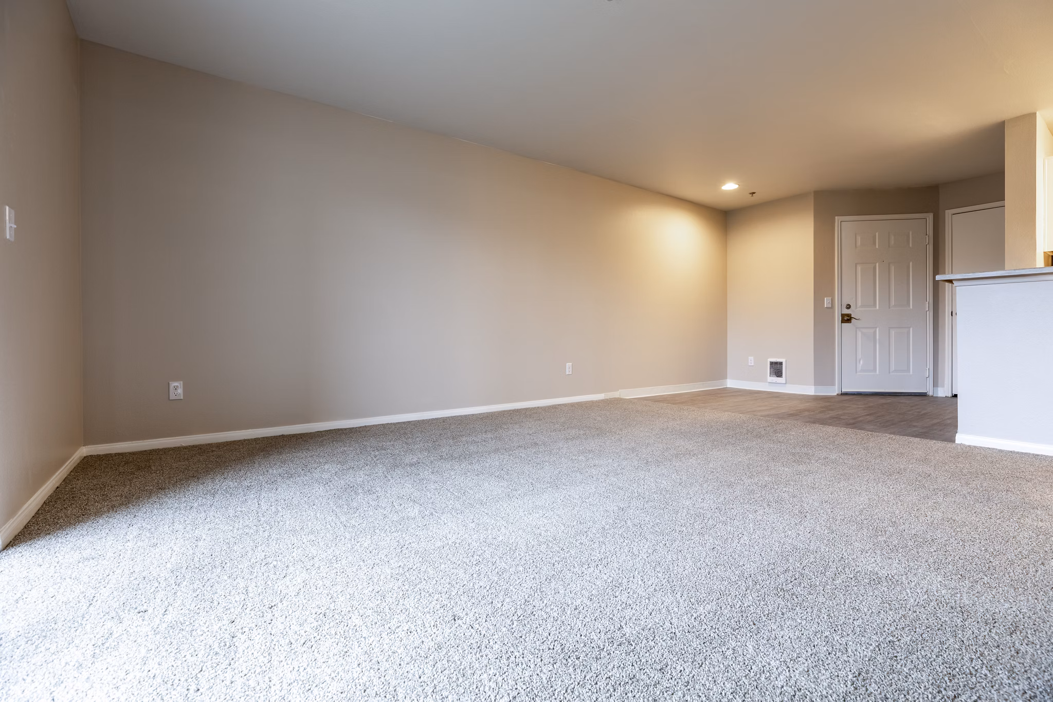 Spacious living room with modern furnishings at Huntington Park Apartments