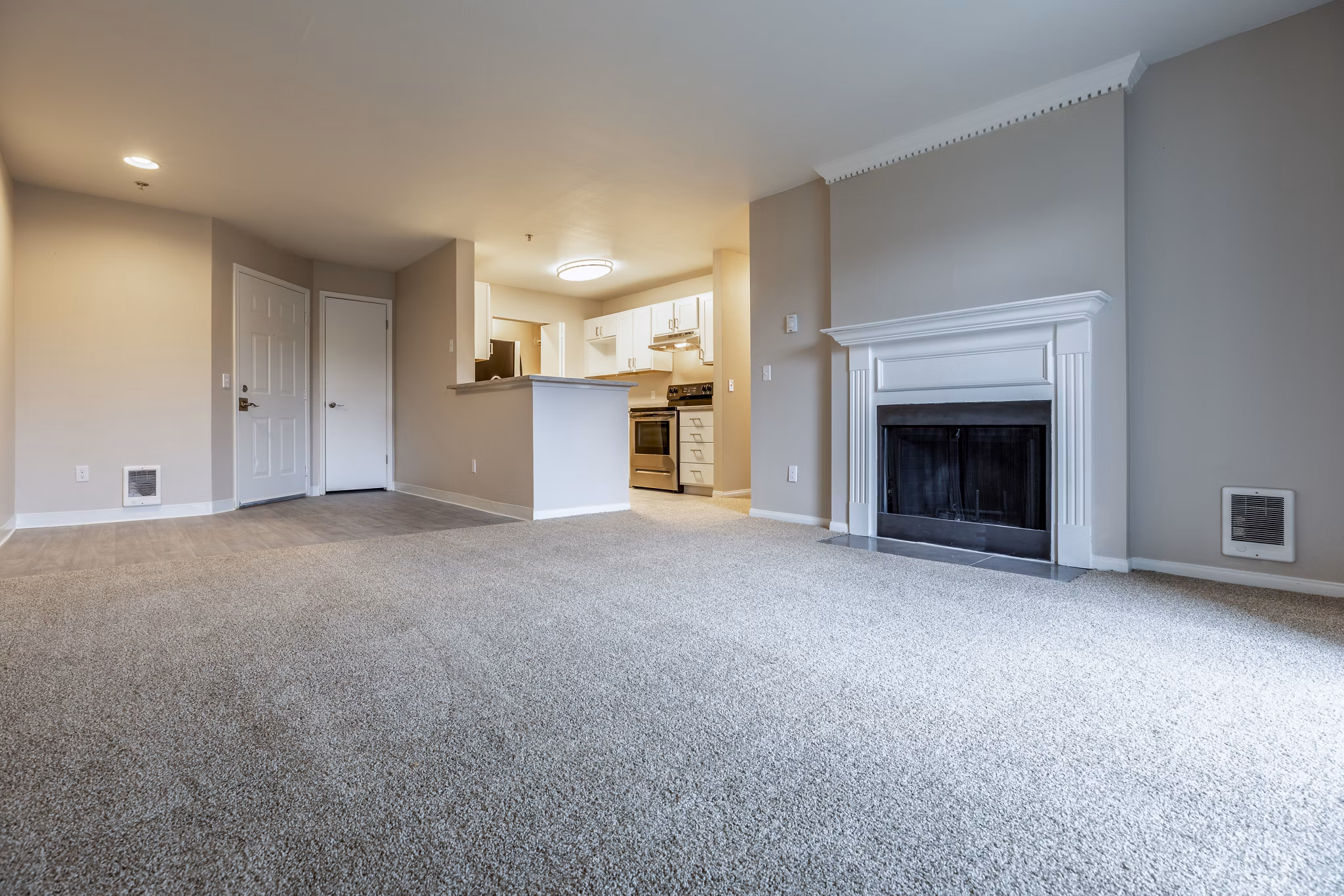 Spacious living room with modern furnishings at Huntington Park Apartments