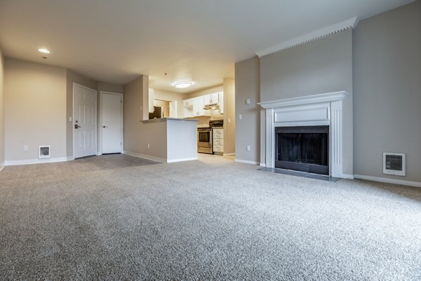 Spacious living room with modern furnishings at Huntington Park Apartments