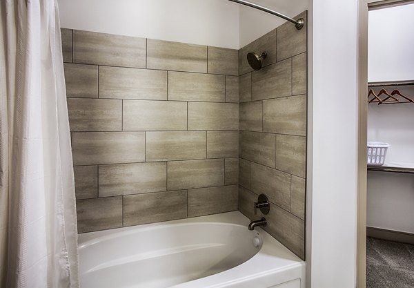 Modern bathroom with sleek fixtures at Raleigh at Sloans Lake Apartments