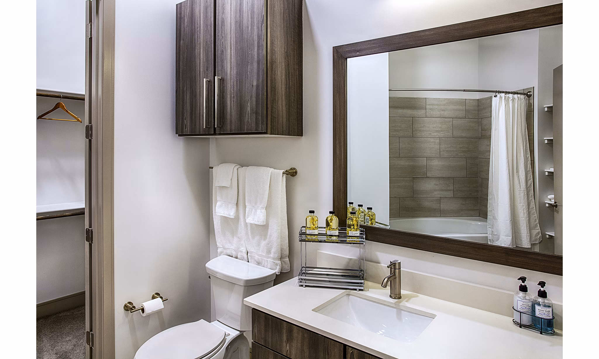 Bathroom featuring sleek fixtures and elegant design at Raleigh at Sloans Lake Apartments