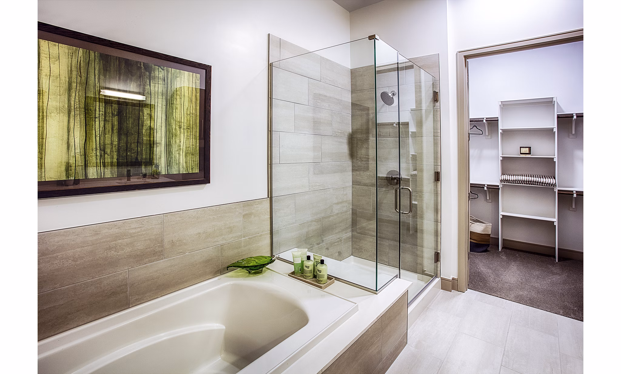 Bathroom with sleek fixtures and elegant tiling in Raleigh at Sloans Lake Apartments