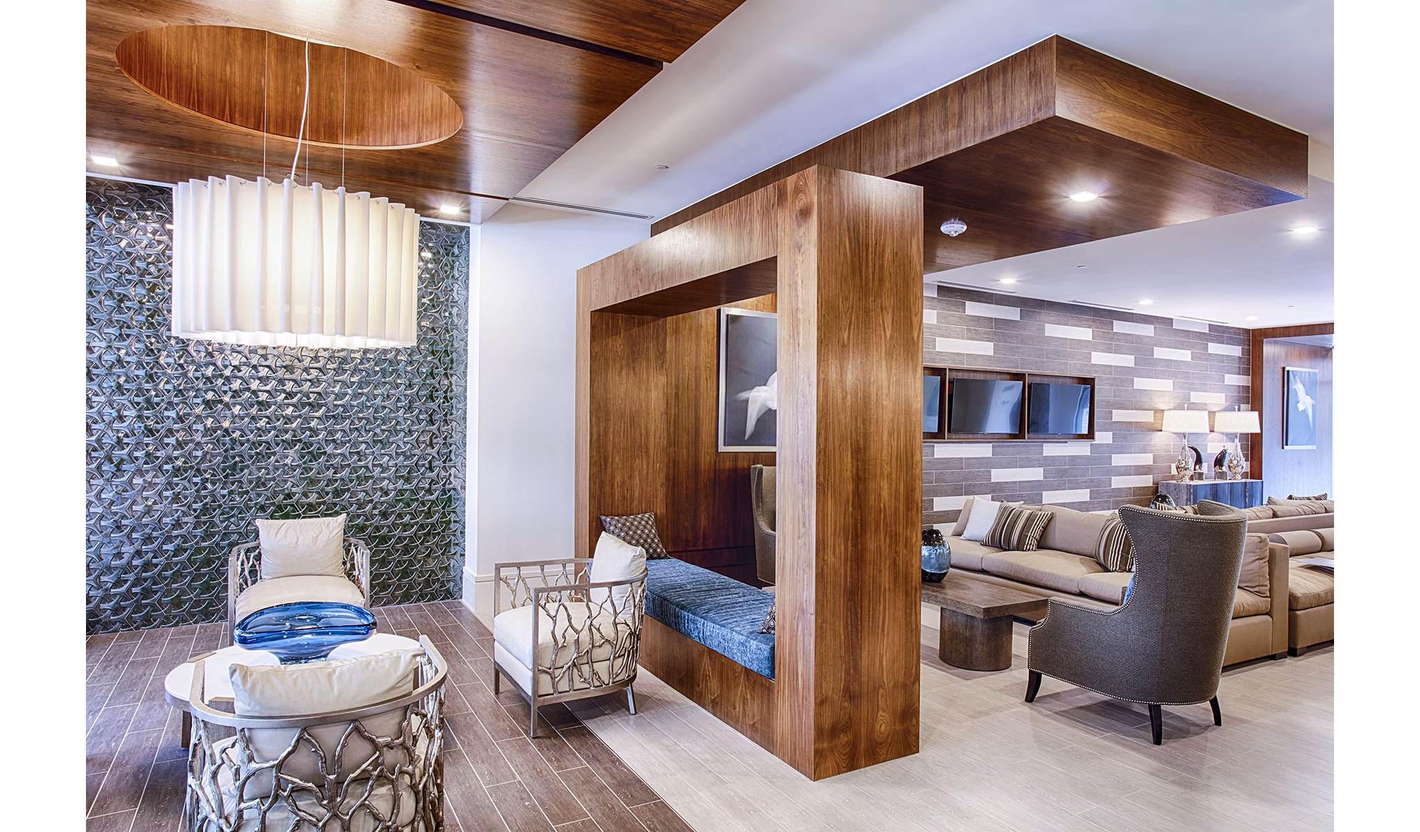 Chic clubhouse lobby with modern seating and lighting at Raleigh at Sloans Lake Apartments