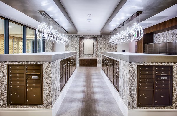 Mail room with individual parcel lockers at Raleigh at Sloans Lake Apartments