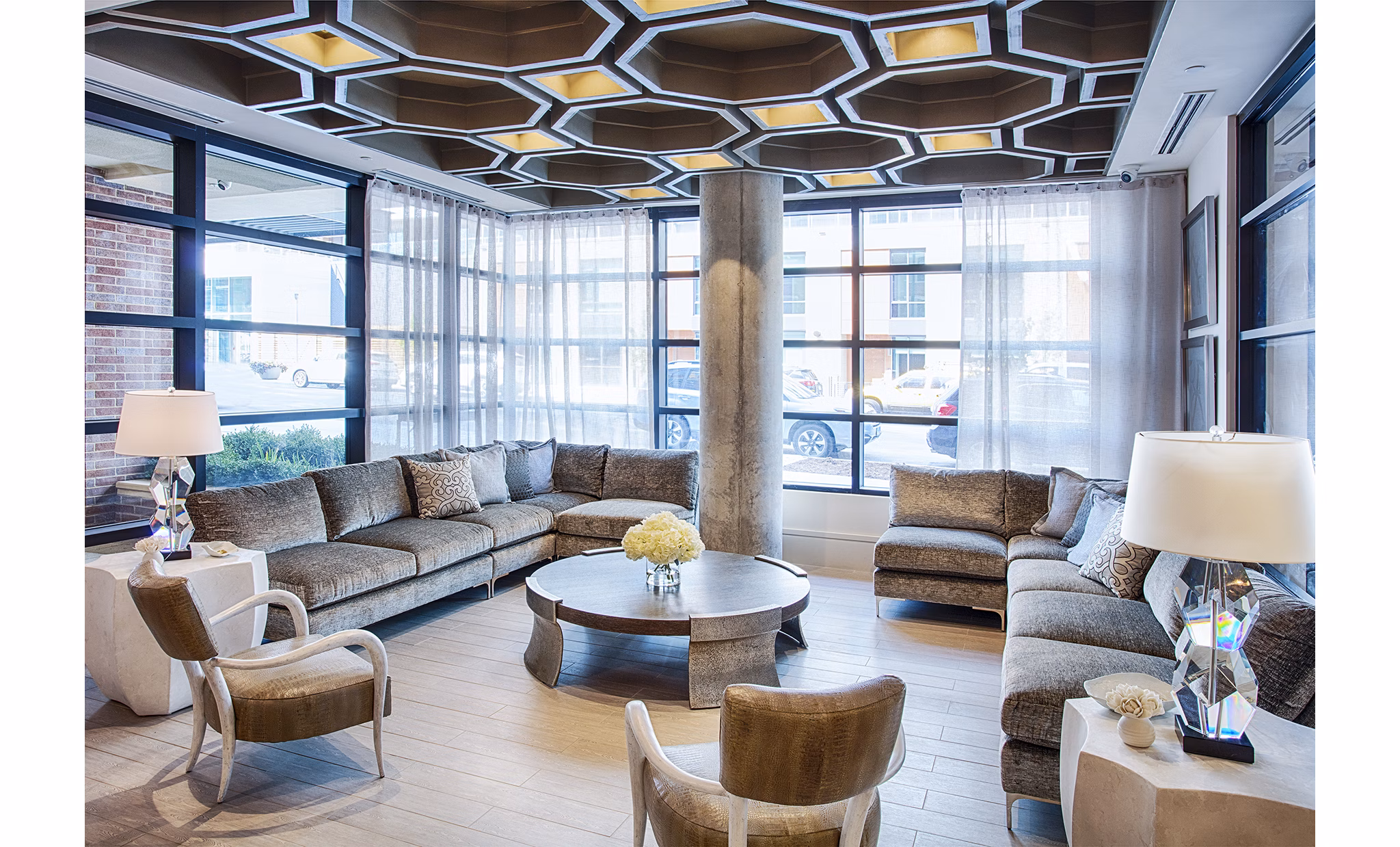 Modern clubhouse and welcoming lobby at Raleigh at Sloans Lake Apartments, featuring stylish seating and open spaces, perfect for social gatherings