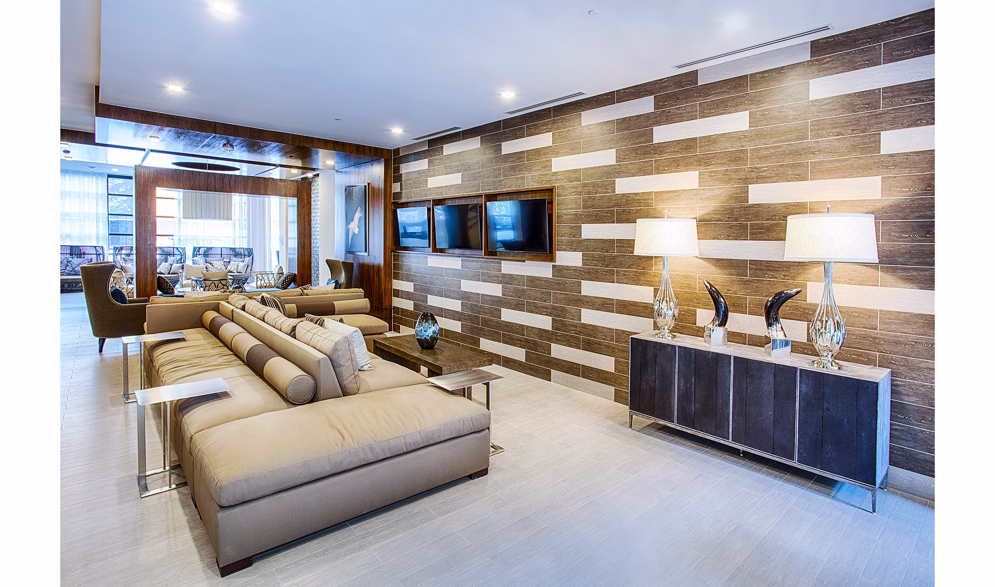 Modern clubhouse lobby with elegant furnishings at Raleigh at Sloans Lake Apartments, offering luxury living