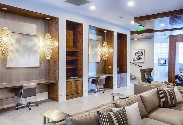 Modern business center with workstations at Raleigh at Sloans Lake Apartments
