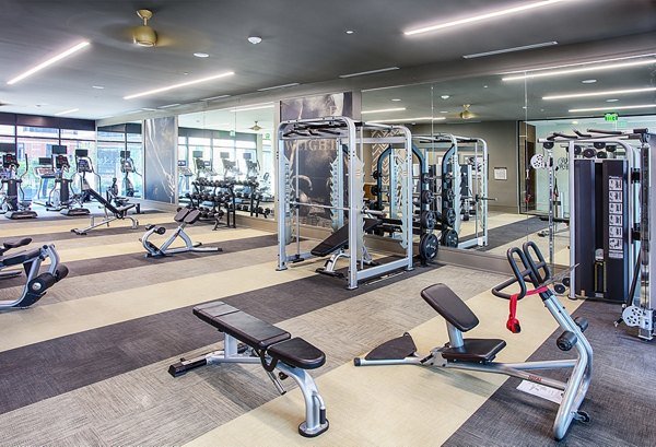Modern fitness center with state-of-the-art equipment at Raleigh at Sloans Lake Apartments, promoting a healthy lifestyle