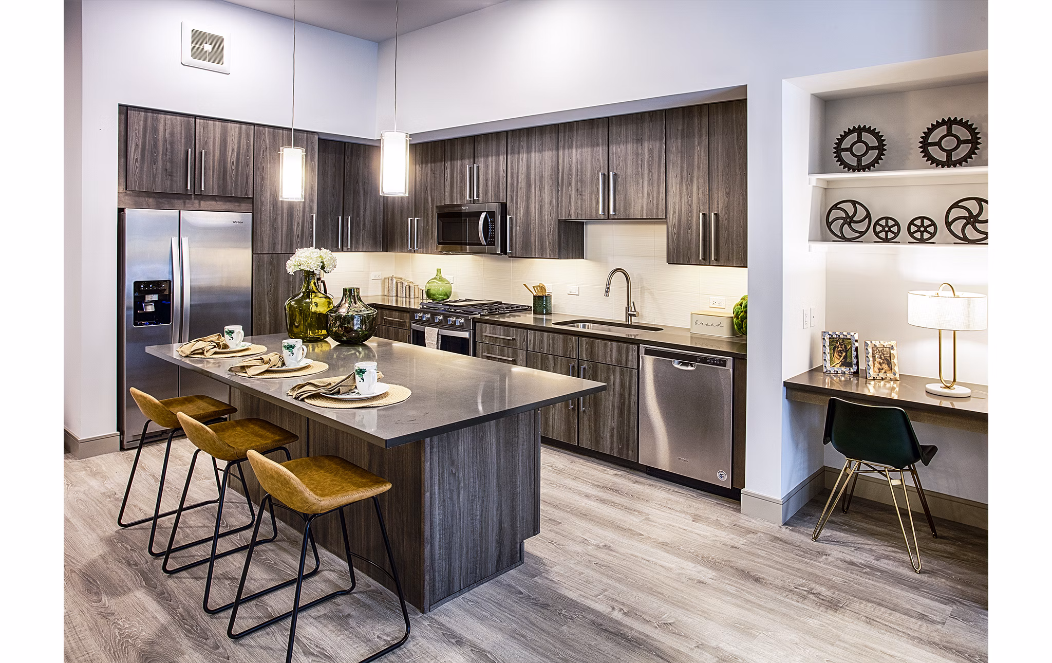 Modern kitchen featuring stainless steel appliances in Raleigh at Sloans Lake Apartments