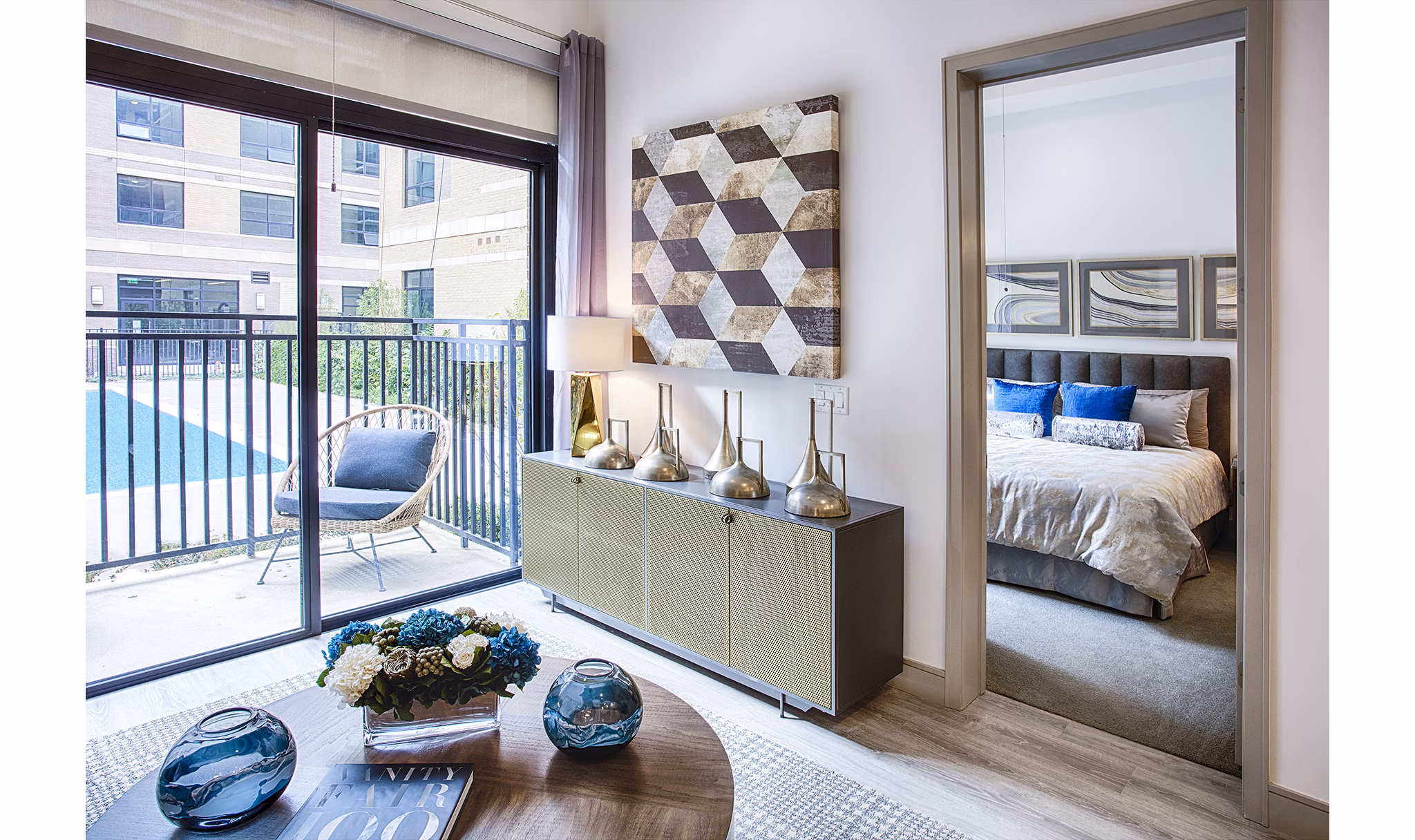 Cozy living room with stylish decor at Raleigh at Sloans Lake Apartments, offering comfort and elegance in a luxury Greystar property