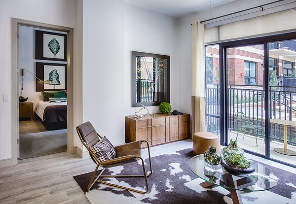 Spacious living room with modern decor at Raleigh at Sloans Lake Apartments in Denver