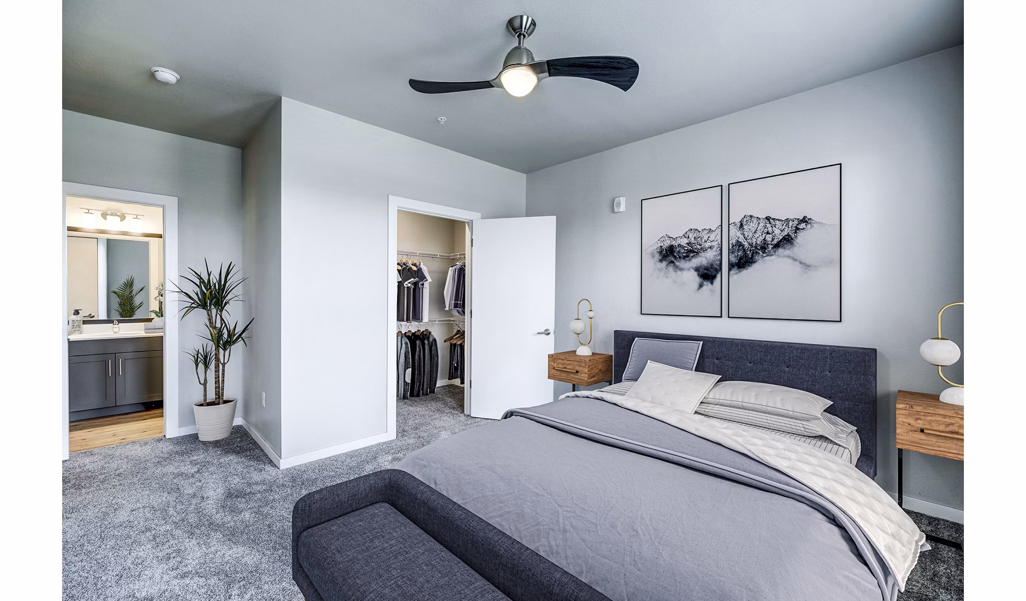 Bedroom featuring modern decor and city views at The Tenzing Apartments Enjoy luxurious living in Greystar's premium apartment community