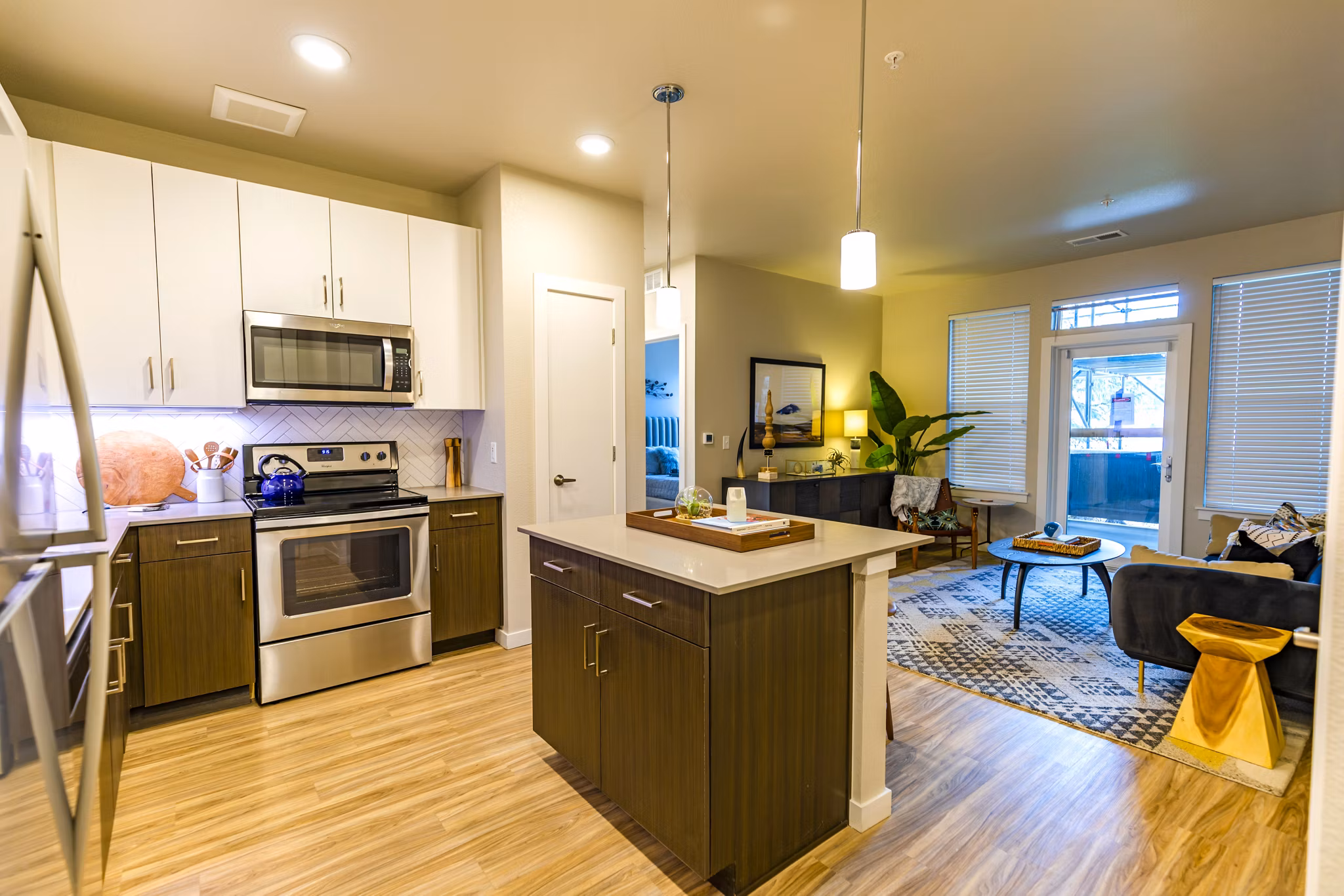 Kleineitze: Modern kitchen with stainless steel appliances at The Tenzing Apartments