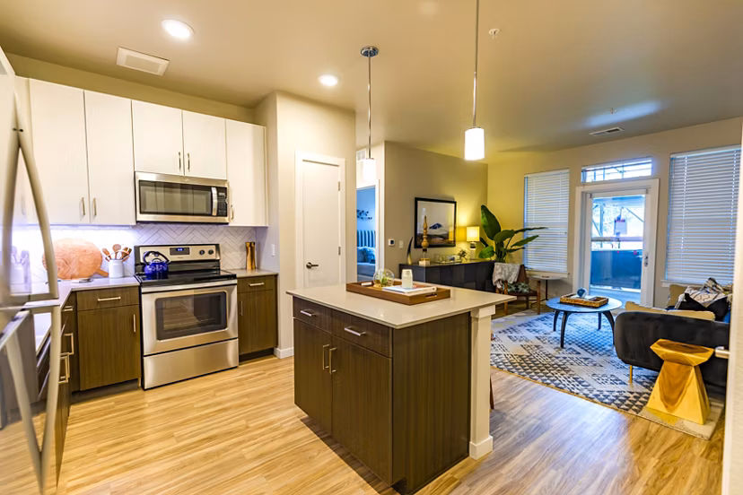 Kleineitze: Modern kitchen with stainless steel appliances at The Tenzing Apartments