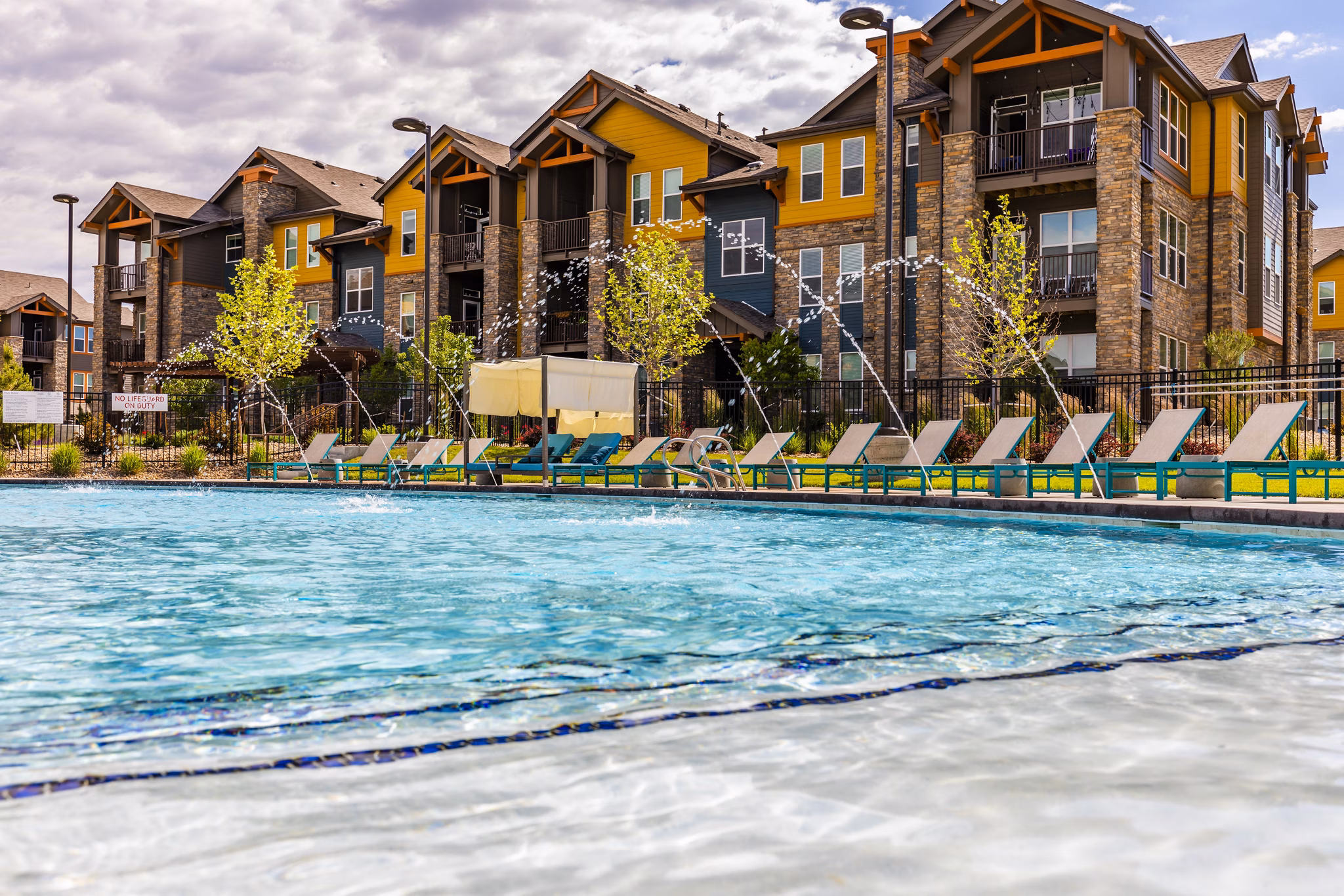 Rooftop pool with scenic views at The Tenzing Apartments, a luxury community by Greystar