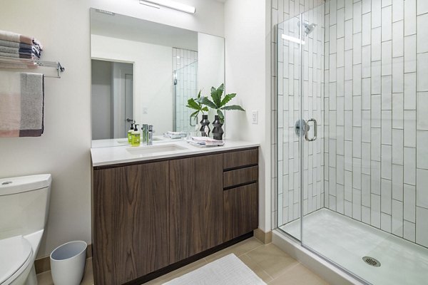 Bathroom with modern fixtures and sleek design at Bower Apartments, luxury living by Greystar