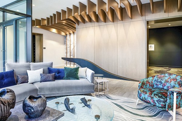 Elegant clubhouse featuring cozy seating and modern decor at Bower Apartments, perfect for socializing and relaxation