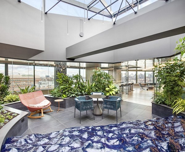 Clubhouse at Bower Apartments: Contemporary design with spacious seating and entertainment areas for social gatherings