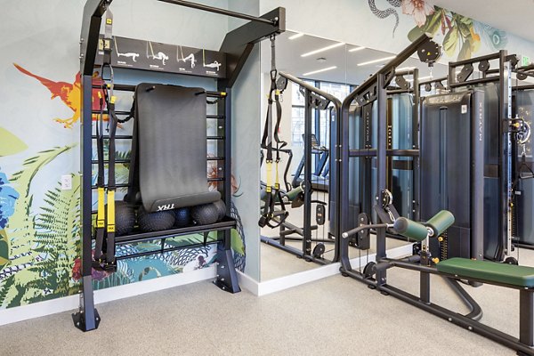 Fully-equipped fitness center at Bower Apartments, featuring modern workout machines and a spacious layout for a luxury workout experience
