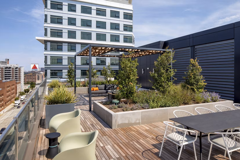 Bower Apartments: Modern patio with outdoor seating and scenic city views