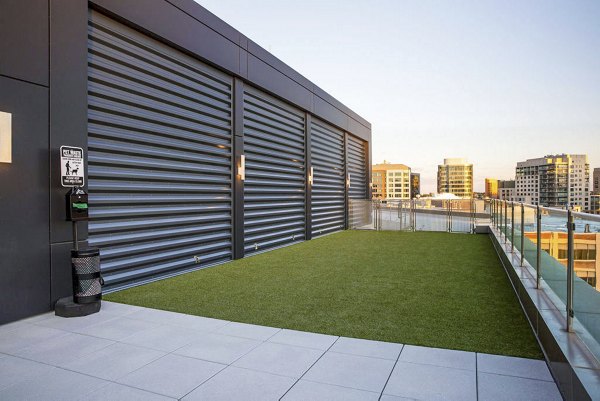 Spacious dog park with agility equipment at Bower Apartments offers a pet-friendly community atmosphere, perfect for residents and their furry friends