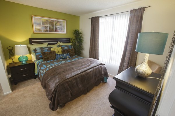 Elegant bedroom with modern decor at 777 Place Apartments in luxurious Greystar community