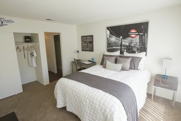 Stylish bedroom with contemporary decor at 777 Place Apartments