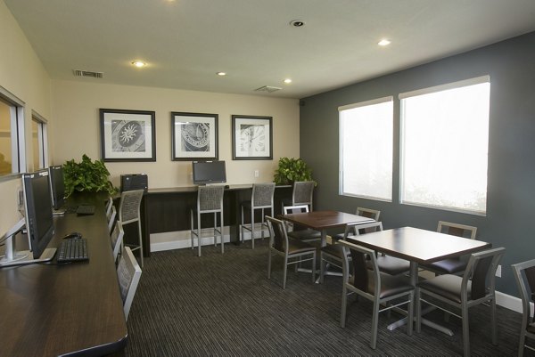 Clubhouse featuring modern design and spacious seating at 777 Place Apartments