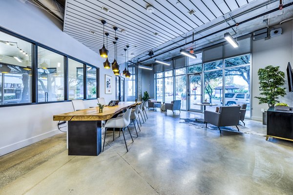Clubhouse featuring modern design and spacious seating at Inspire Downtown Apartments leasing office
