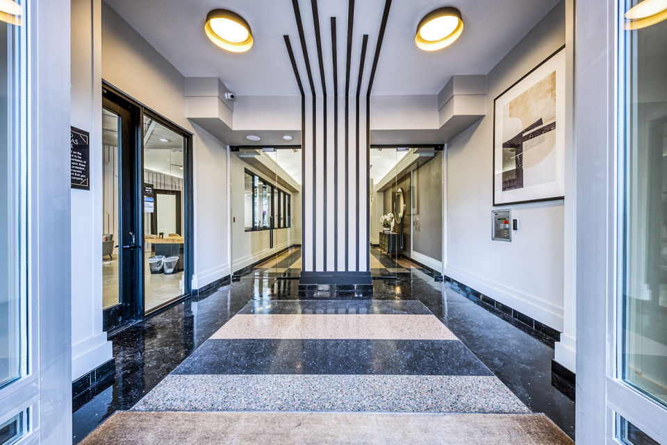 Contemporary hallway with sleek lighting at Inspire Downtown Apartments