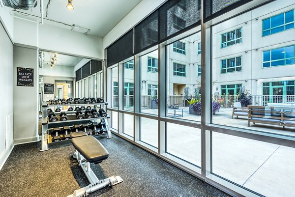 Modern fitness center with state-of-the-art equipment at Inspire Downtown Apartments