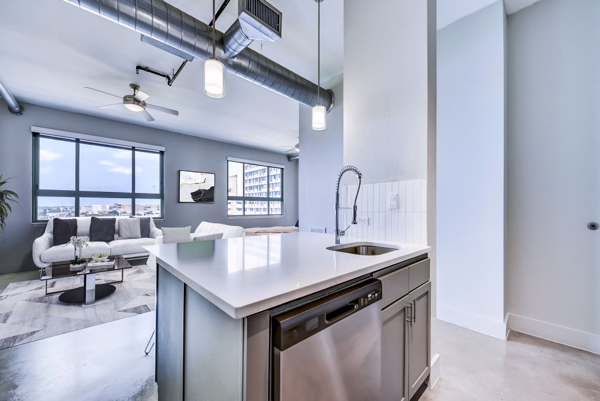 Interior space featuring sleek kitchen design with modern appliances at Inspire Downtown Apartments