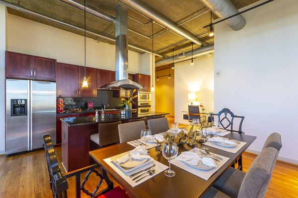 Dining area with modern furniture and elegant lighting at The Museum Tower Apartments