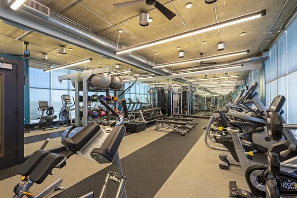 Modern fitness center with state-of-the-art equipment at The Museum Tower Apartments