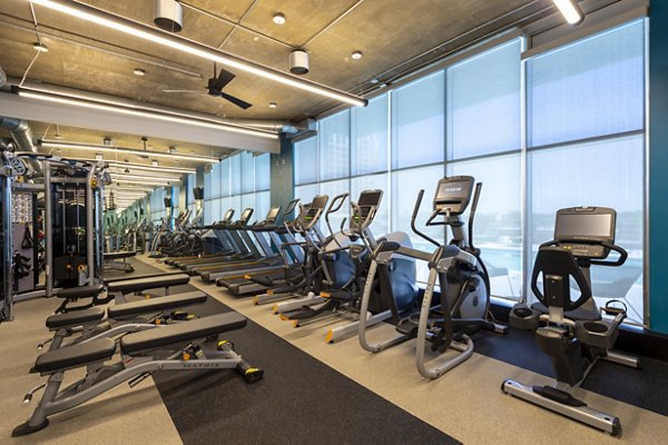 Modern fitness center featuring state-of-the-art equipment at The Museum Tower Apartments