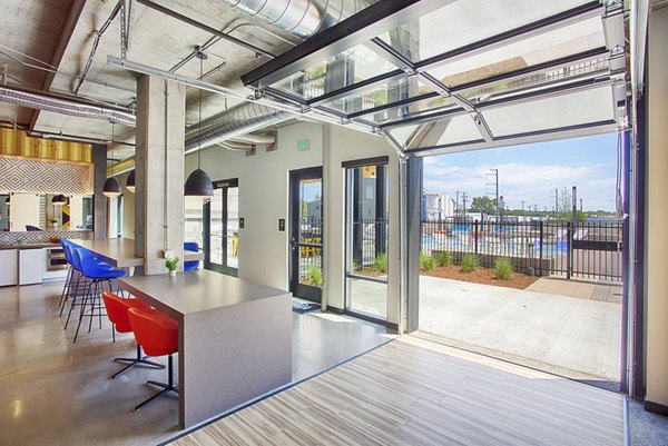 Clubhouse with modern seating and decor at South Main Station Apartments