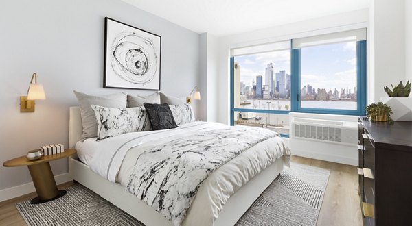 Bedroom featuring elegant design and modern furniture at Hamilton Cove Apartments