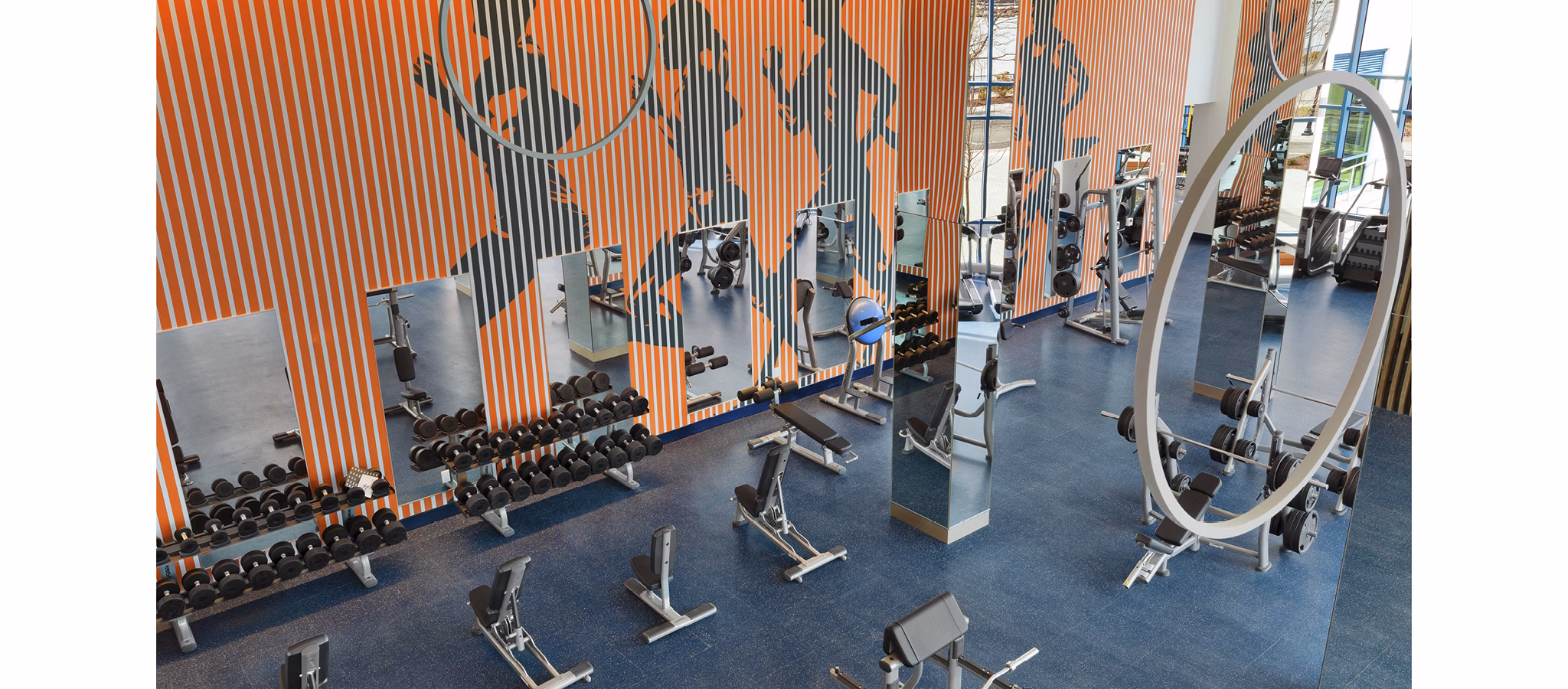 State-of-the-art fitness center with modern equipment at Hamilton Cove Apartments in a luxury setting